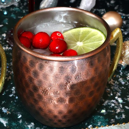 Santa’s little helper. This quick, easy, and incredible Cranberry Mule!